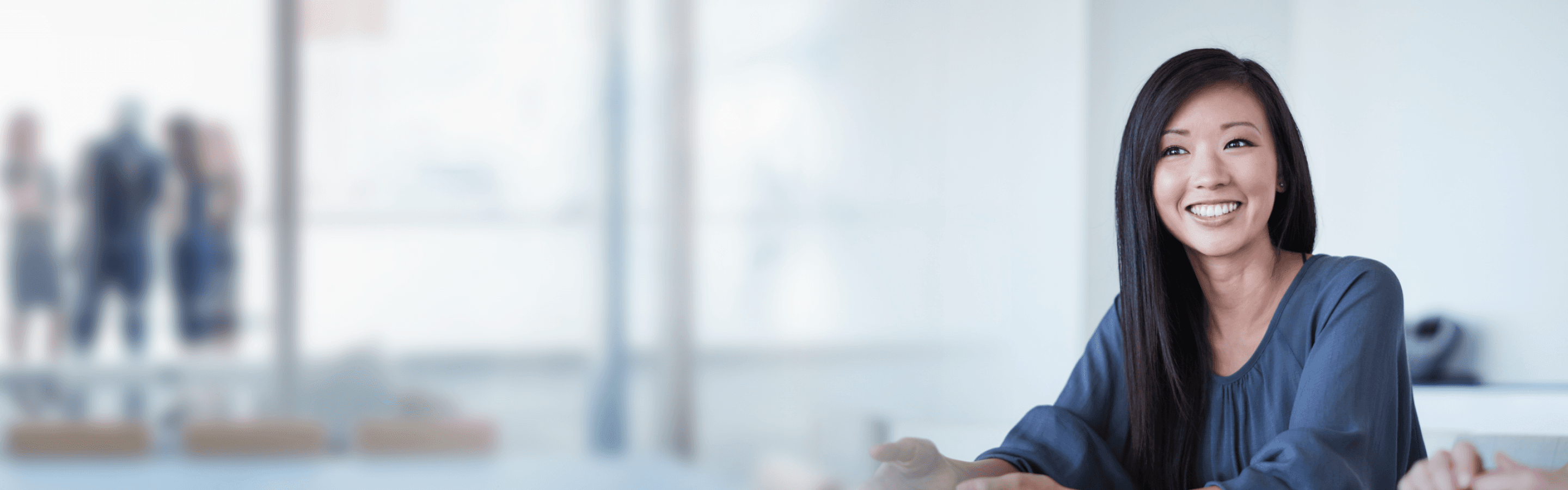 A Jominsure advisor consulting in a modern office.